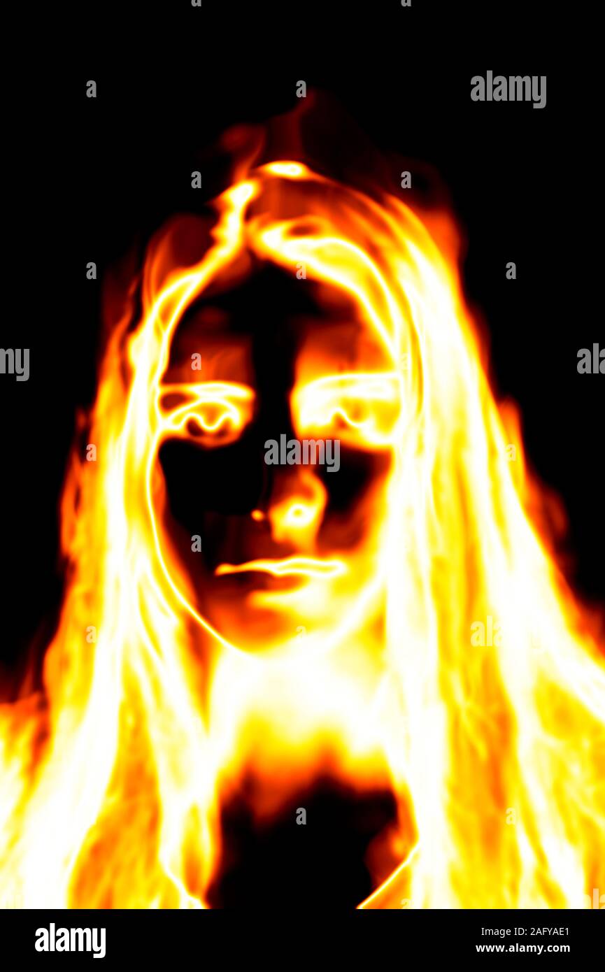 woman face on fire, horror effect Stock Photo