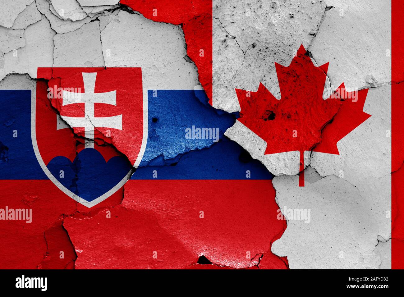 flags of Slovakia and Canada painted on cracked wall Stock Photo Alamy