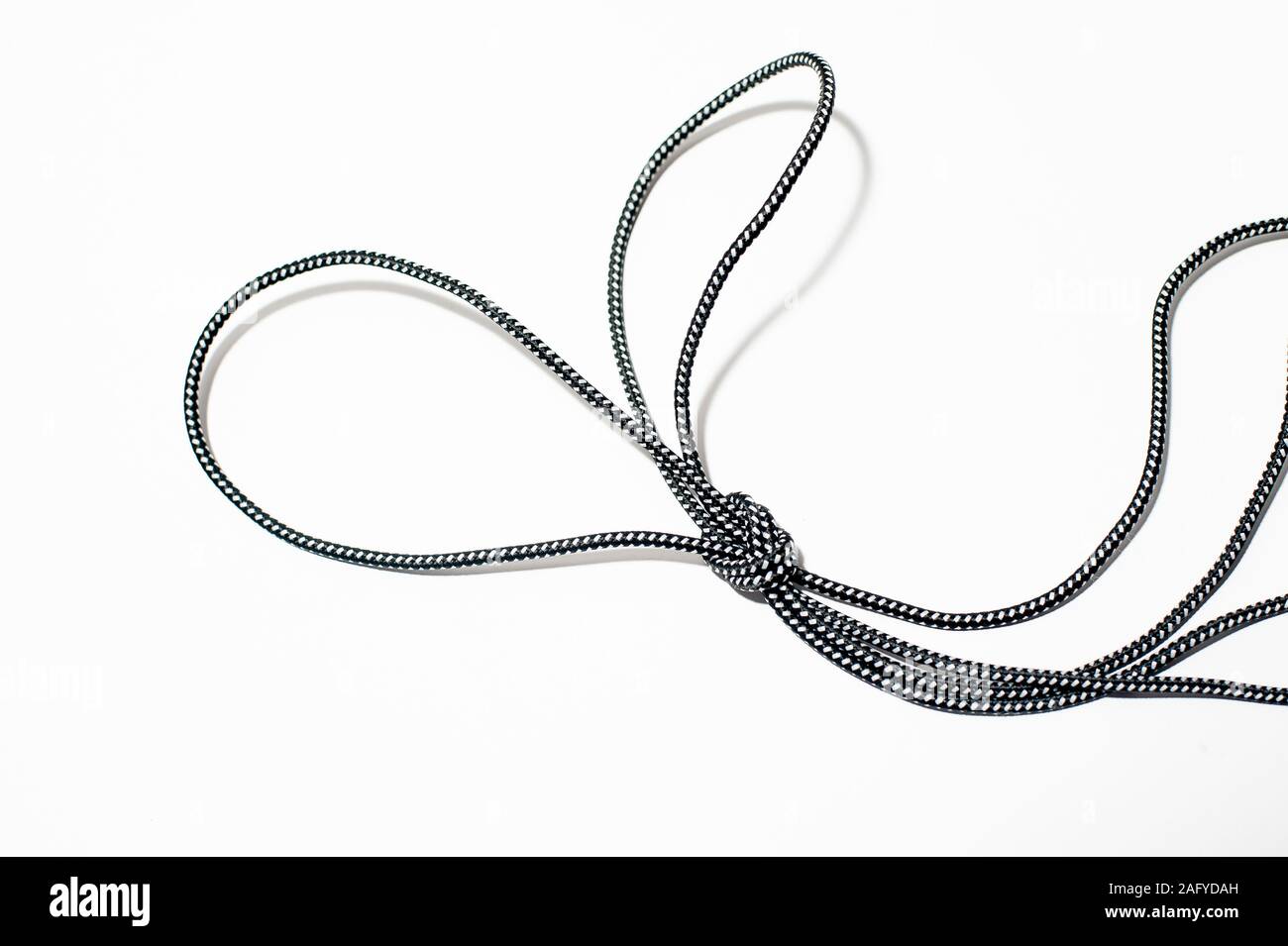 A bunny ears knot on white background Stock Photo - Alamy