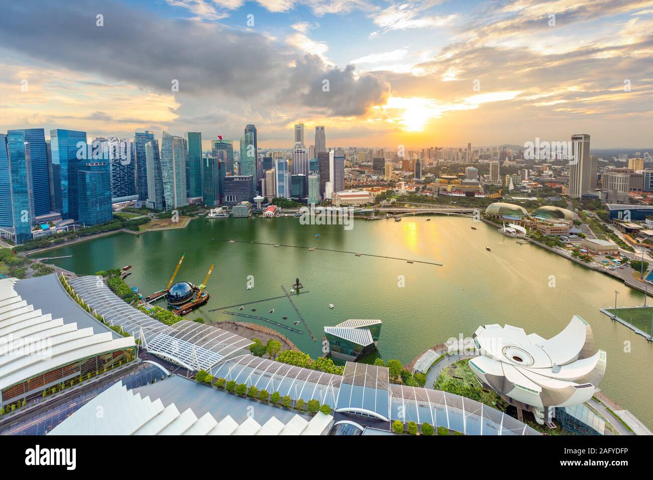 Aerial view of cloudy sunset at Marina Bay Singapore city skyline Stock Photo