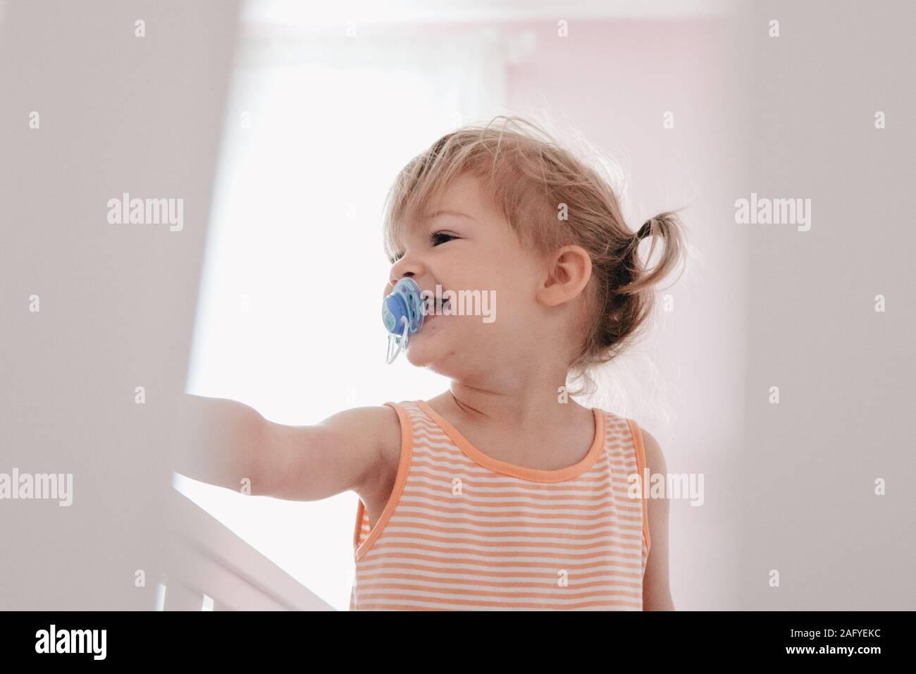 happy toddler wakes up from a nap Stock Photo Alamy