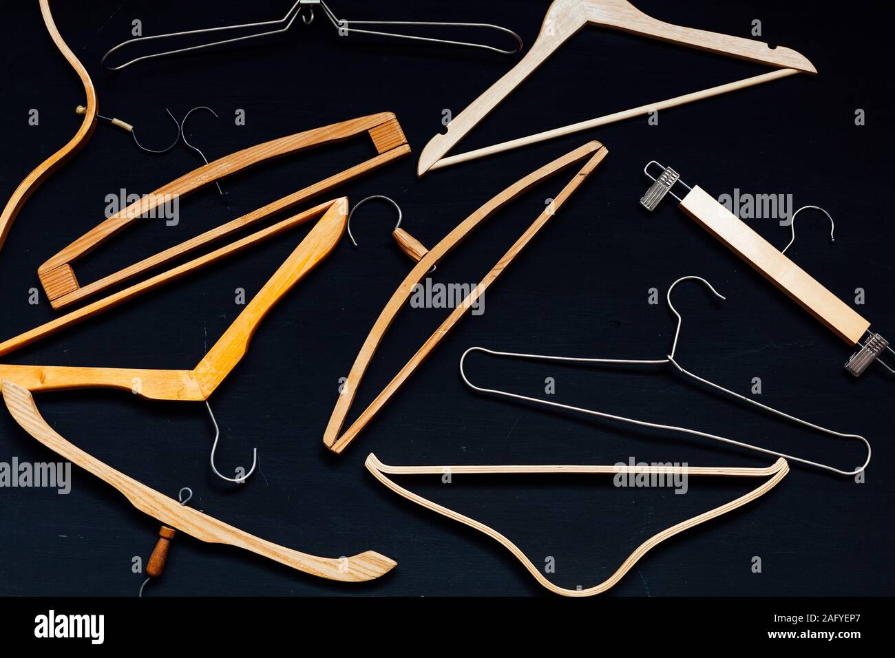 old wooden hangers for things on the table background Stock Photo Alamy