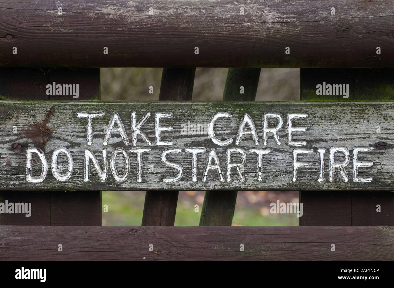 'TAKE CARE DO NOT START FIRE' warning sign. Stock Photo