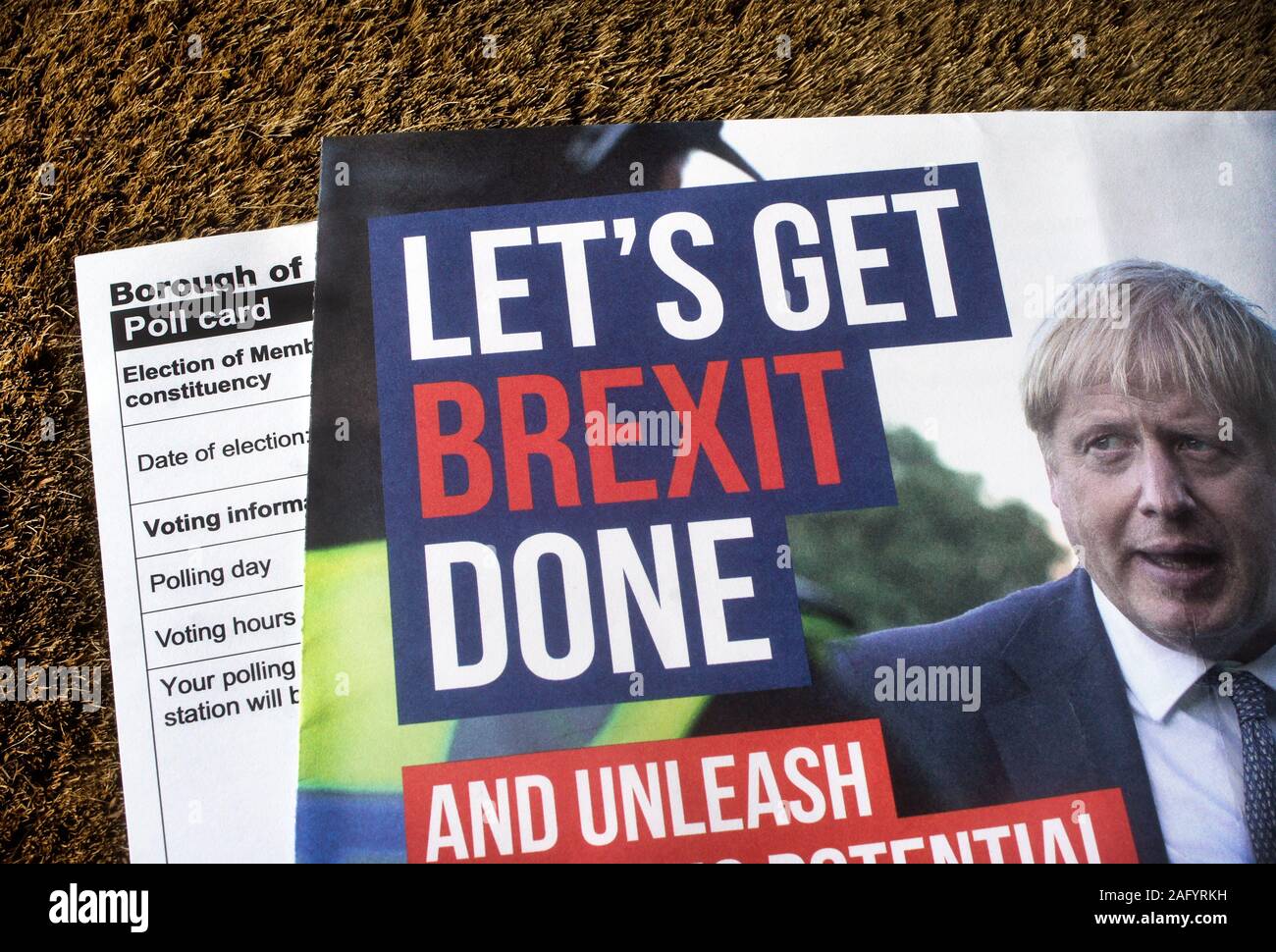British general election 2019. Let's Get Brexit Done slogan on Conservative party leaflet on door mat with polling card. Stock Photo