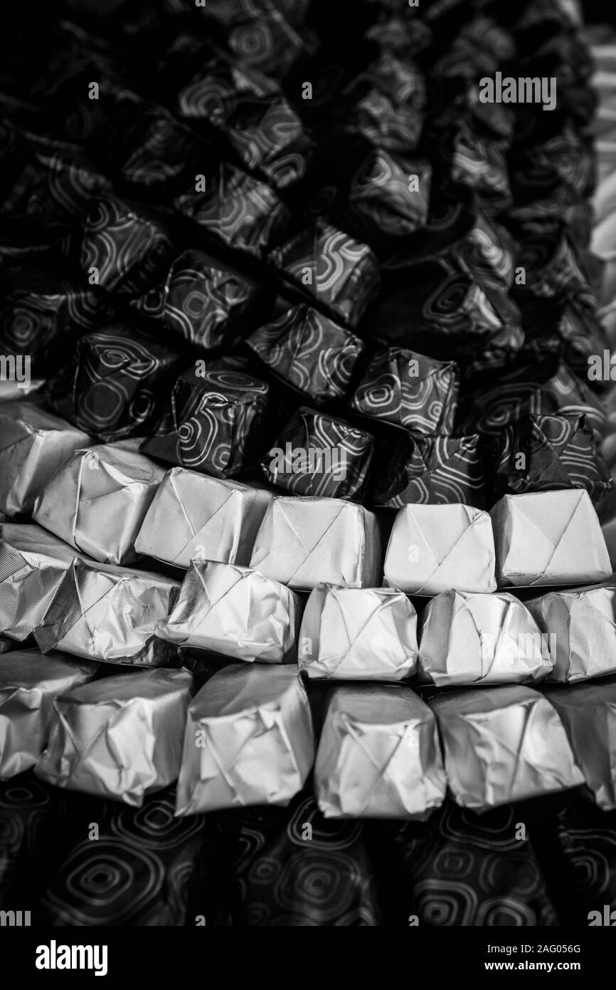 Black and white shot of arranged chocolates Stock Photo