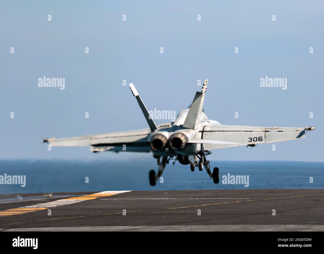 A U.S. Navy F/A-18E Super Hornet fighter aircraft attached to the Sidewinders of Strike Fighter Squadron 86, launches from the flight deck of the Nimitz-class aircraft carrier USS Abraham Lincoln in support of Operation Inherent Resolve December 13, 2019 in the Arabian Gulf. Stock Photo