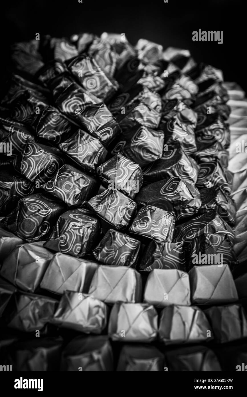 Black and white shot of arranged chocolates Stock Photo