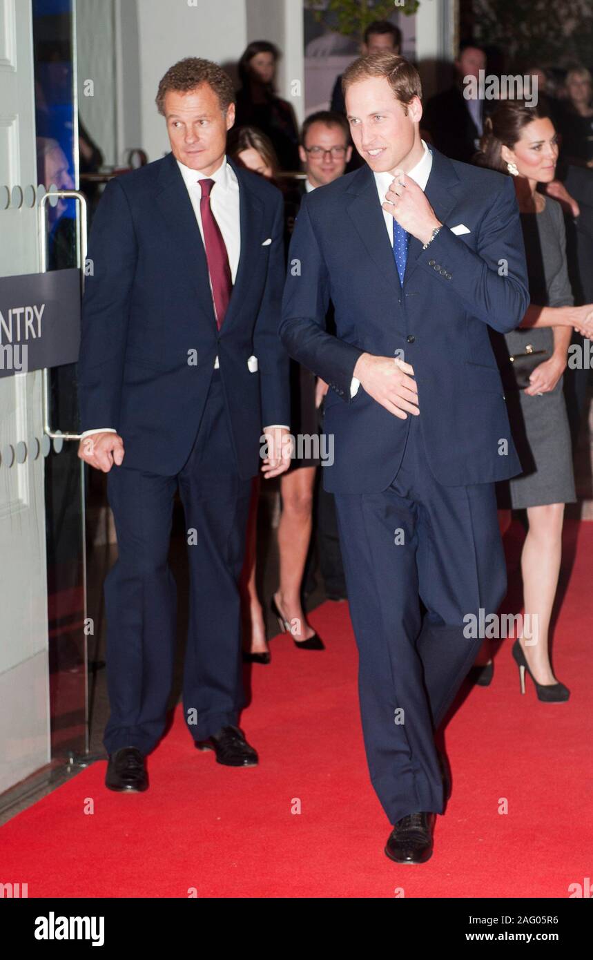 Viscount Rothermere chairman of the IWM Foundation welcoming The Duke and Duchess of Cambridge to a fund raising event at the Imperial War museum in London in 2012. Stock Photo