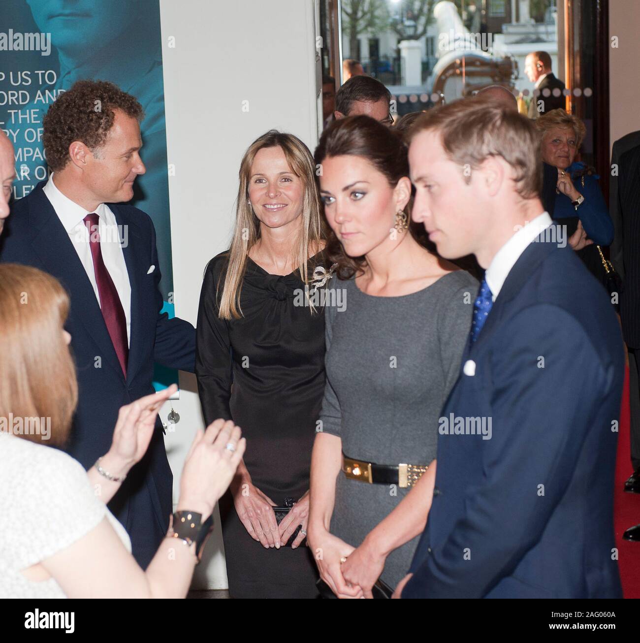 Viscount and Viscountess Rothermere chairman of the IWM Foundation welcoming The Duke and Duchess of Cambridge to a fund raising event at the Imperial War museum in London in 2012. Stock Photo