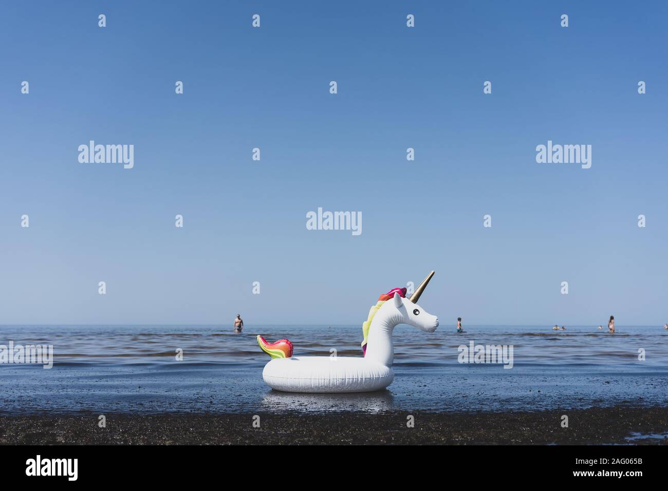 Inflatable unicorn toy on the beach Stock Photo