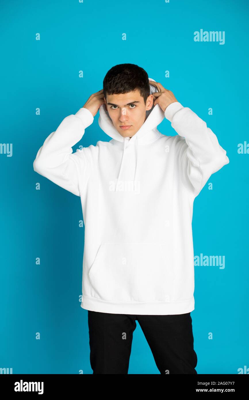 Young man in a white hoodie. Mock-up. Stock Photo