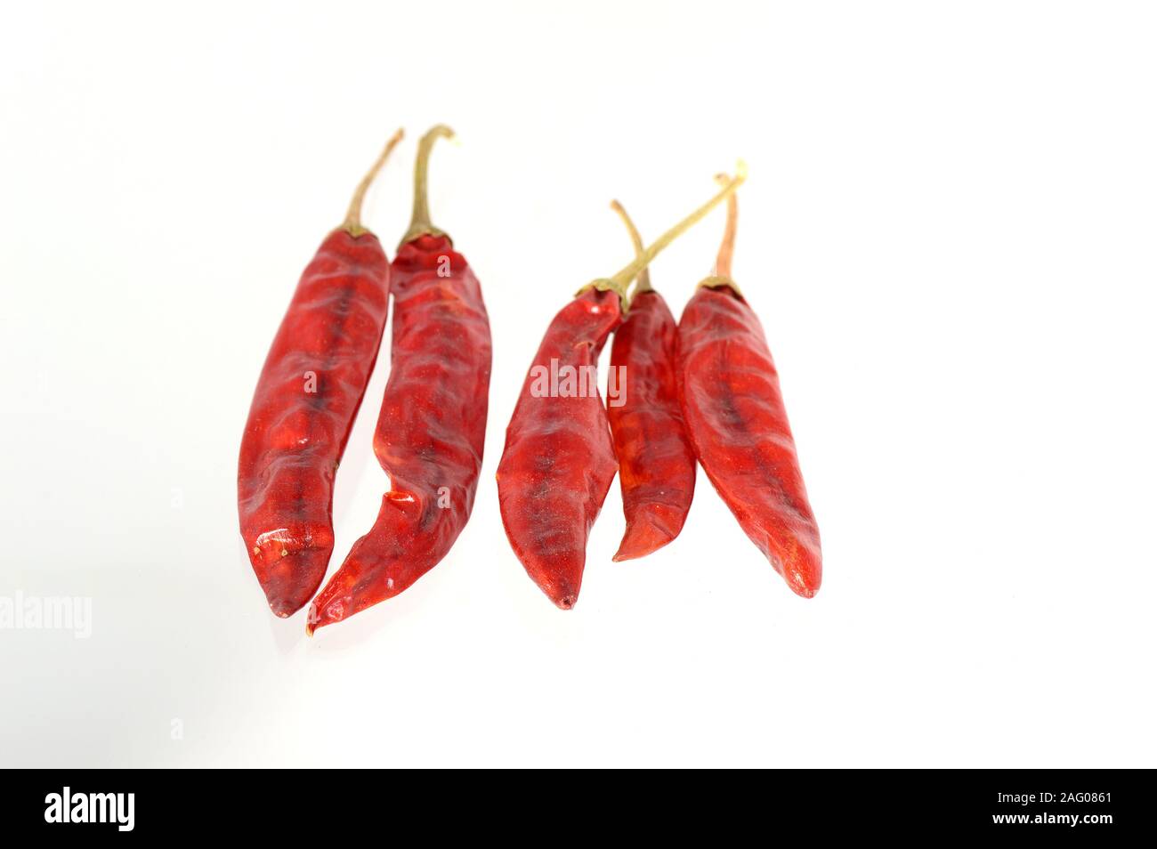 Red Chilli peppers isolated on white Stock Photo - Alamy