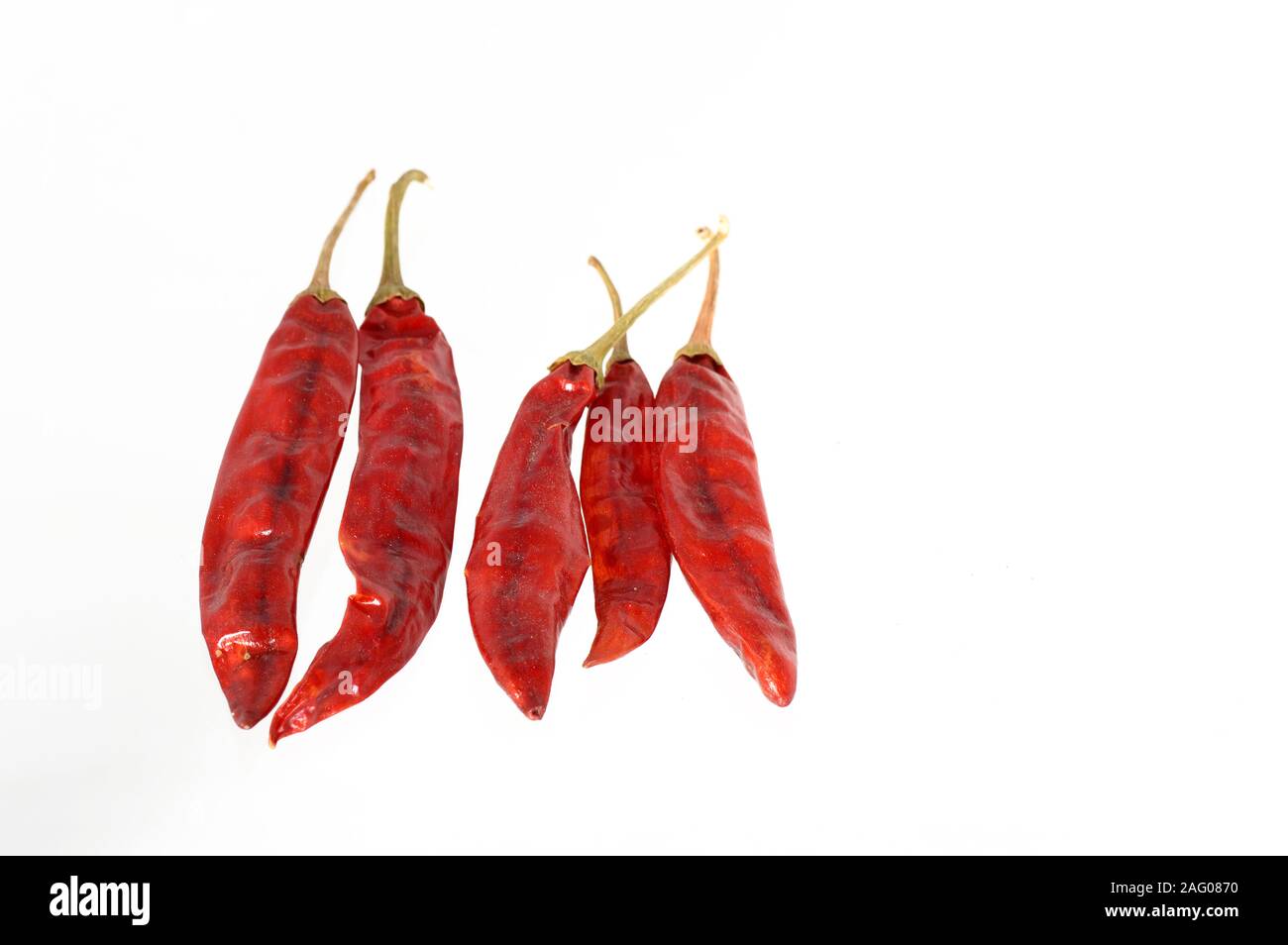 Red Chilli peppers isolated on white Stock Photo - Alamy