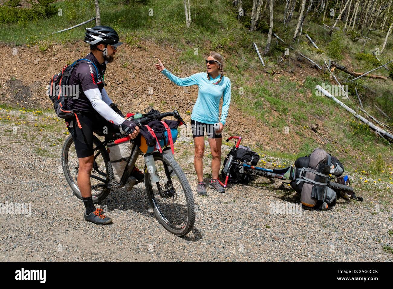 CO00113-00...COLORADO - Vicky Springs talks with a south bound cyclist  on the Great Divide Mountain Bike Route Near Marshall Pass along Forest Road Stock Photo
