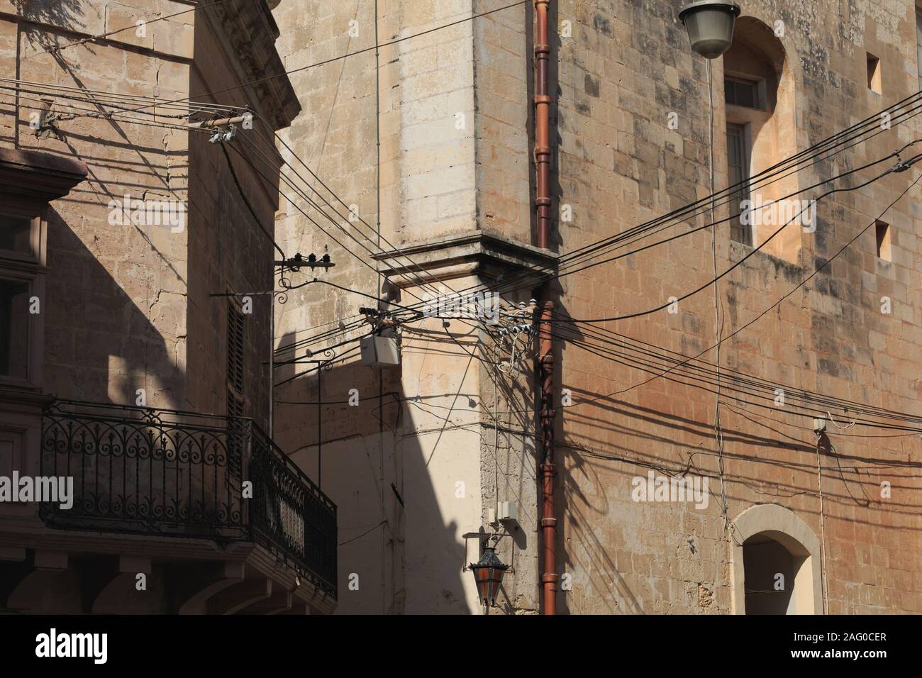 Messy electrical cables on buildings in Malta close up view Stock Photo