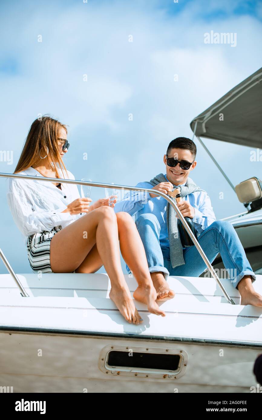 Two young tourists having fun on boat tour in the summertime Stock Photo