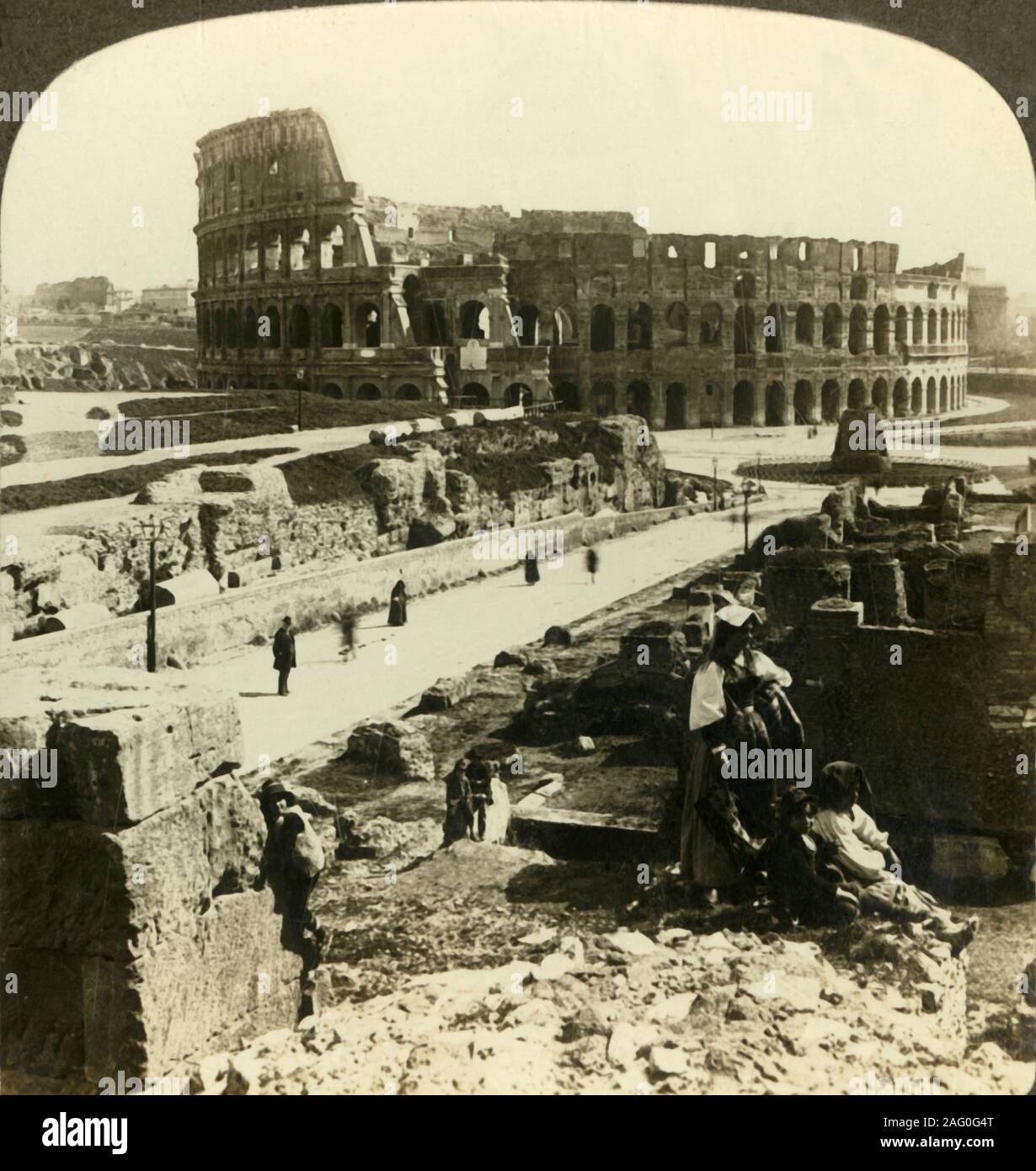 'A mighty monument to pagan brutality - the Colosseum (E.) at Rome', c1909. Flavian amphitheatre in Rome, used for gladiatorial contests and public spectacles, built of travertine limestone. Begun under emperor Vespasian in AD 72 and completed in AD 80 under his successor and heir, Titus. To be viewed on a Sun Sculpture stereoscope made by Underwood &amp; Underwood. [The Rose Stereograph Company, Melbourne, Sydney, Wellington &amp; London, c1909] Stock Photo