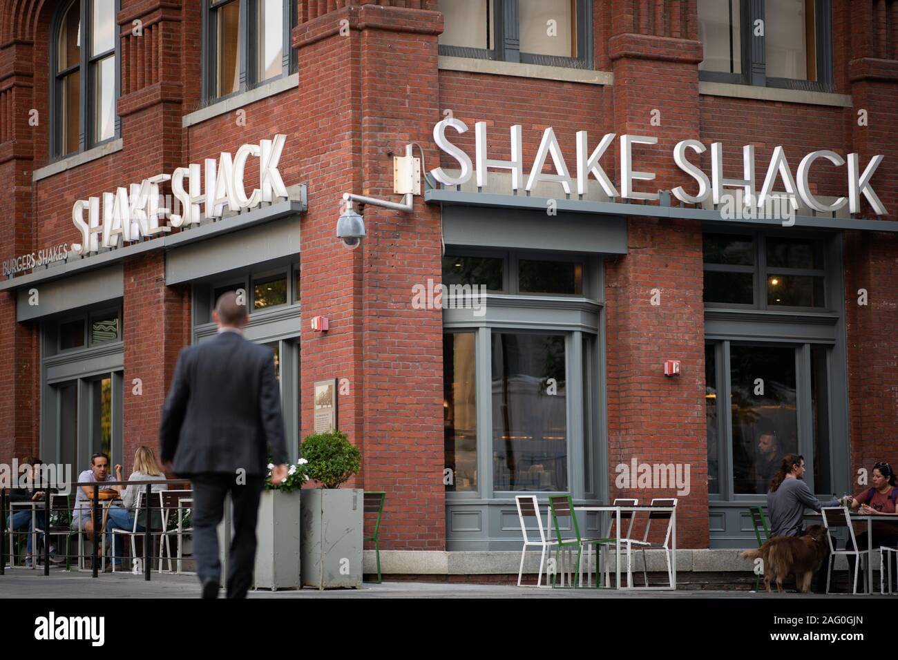A man walks in front of a Shake Shack storefront in Washington, D.C., as seen on September 8, 2019. (Graeme Sloan/Sipa USA) Stock Photo
