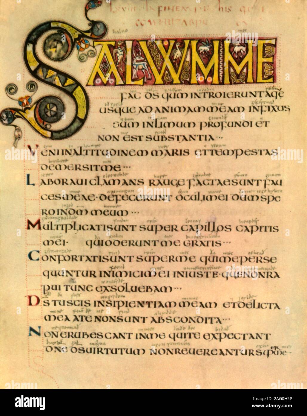 'A Page from the Earliest English Psalter', (1947). Illustration and Latin text from a Book of Psalms: 'St Jerome's Roman Version with Canticles and Hymns written in England in the 8th century. The Anglo-Saxon interlinear translation was added in the 9th century'. Manuscript in the British Library, London. From &quot;English Hymns and Hymn Writers&quot;, by Adam Fox. [Collins, London, 1947] Stock Photo
