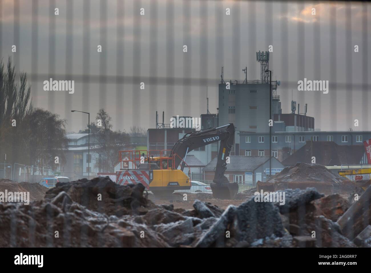Industrial landscape view of a UK building site on a cold, misty, frosty, winter morning in December. Stock Photo