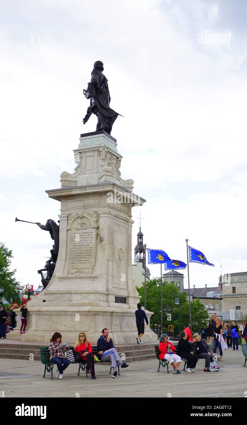 Visitors resting by the Samuel De Champlain statue in Quebec City, Canada Stock Photo