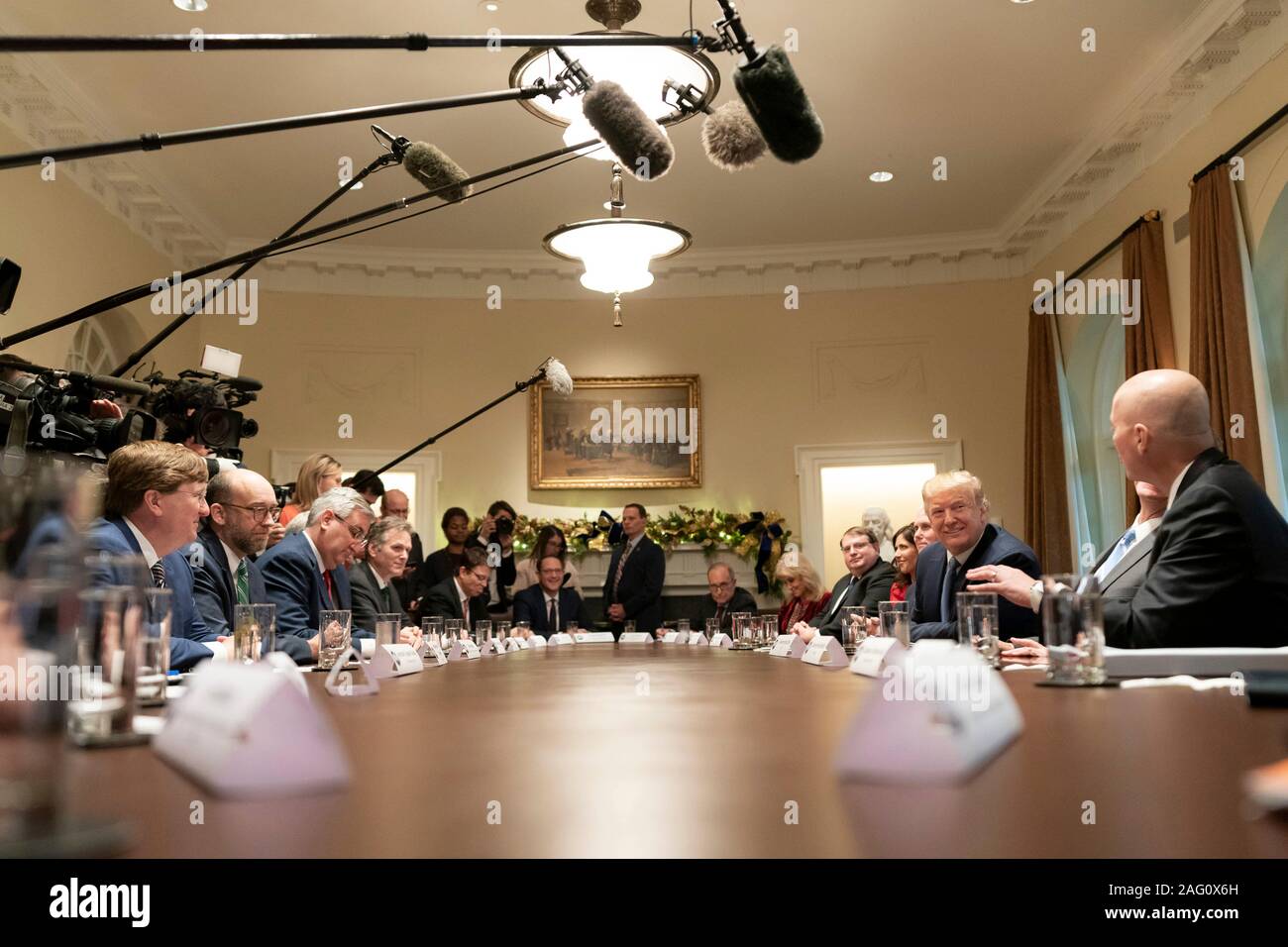 Washington, United States of America. 16 December, 2019. U.S President Donald Trump and Vice President Mike Pence host a roundtable on on the Governors Initiative on Regulatory Innovation in the Cabinet Room of the White House December 16, 2019 in Washington, DC.  Credit: Tia Dufour/White House Photo/Alamy Live News Stock Photo