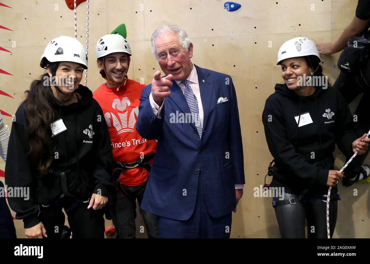 The Prince of Wales meets young people at the climbing wall during the opening of the Prince's Trust charity's new south London centre in Southwark. Stock Photo