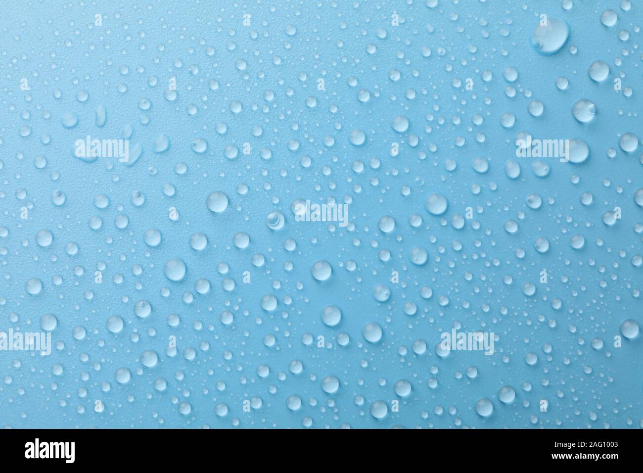Many water drops on blue background. Texture background Stock Photo - Alamy