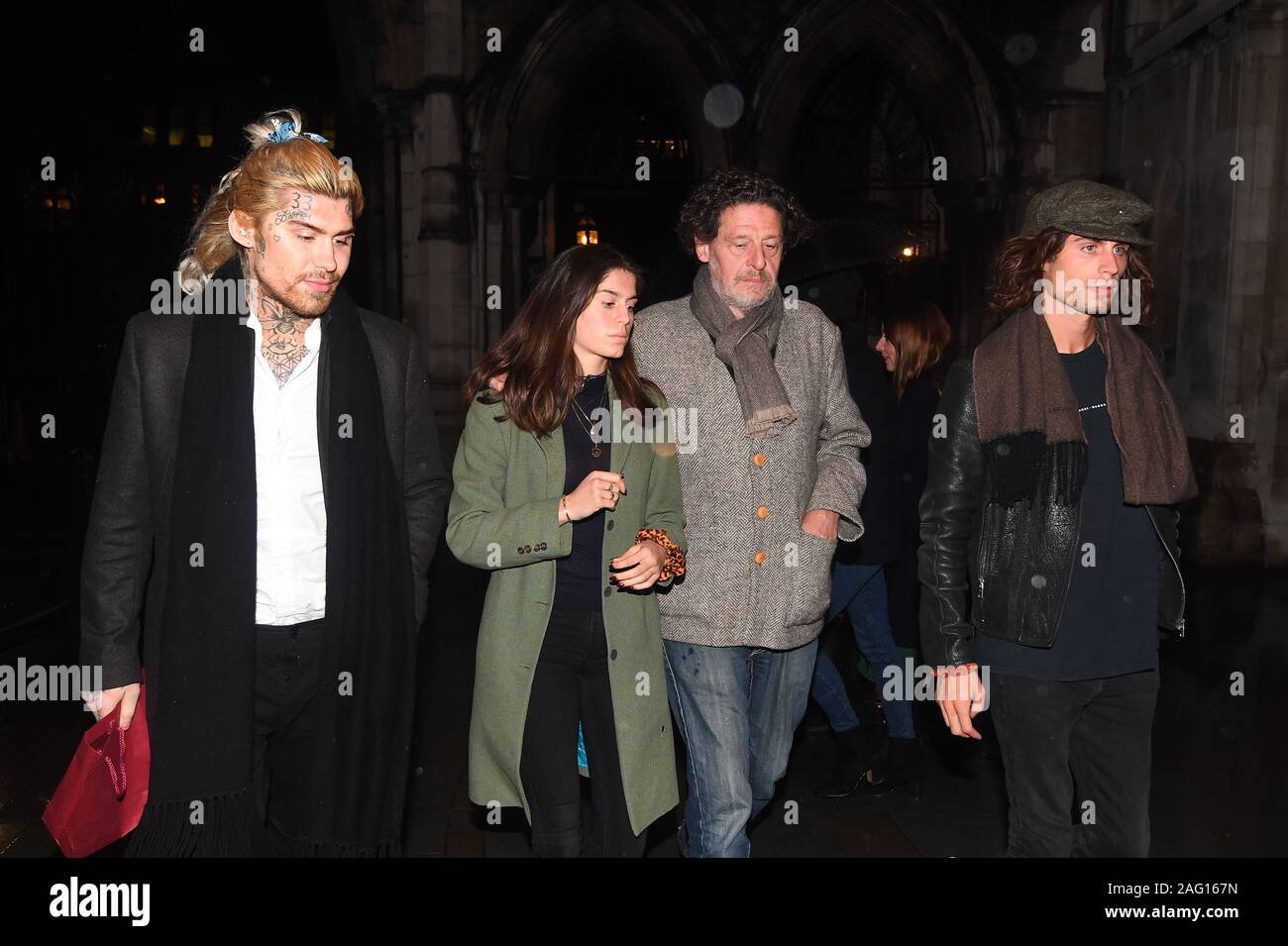 Marco Pierre White (centre right) leaves the Royal Courts of Justice in London accompanied by his children Marco White Jr (left) and Luciano White (right), as the chef and his estranged wife Matilde are embroiled in a High Court row over money. Stock Photo