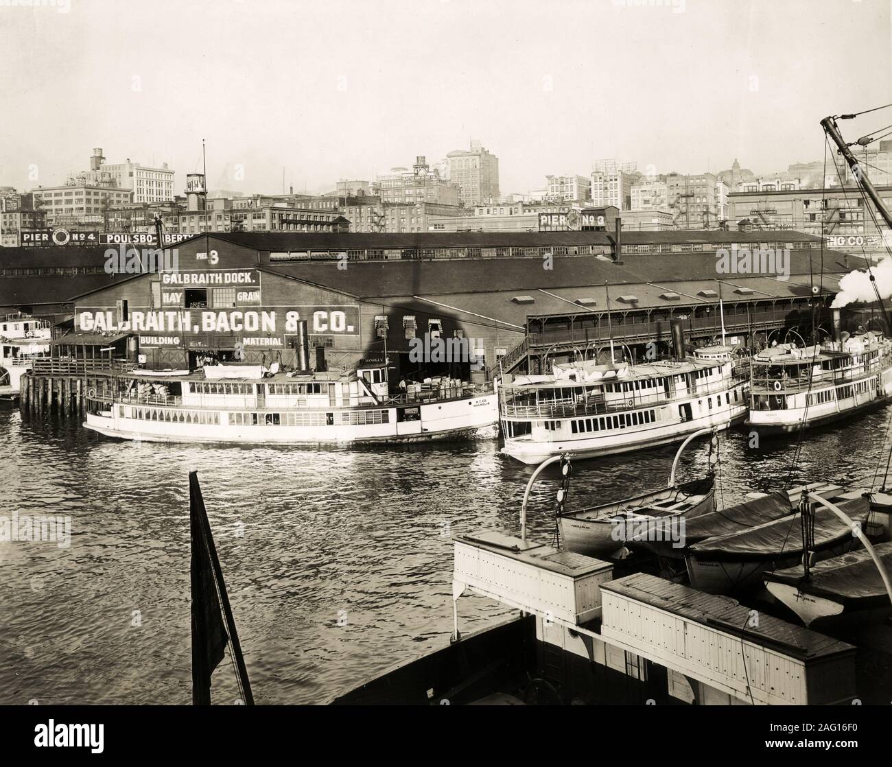 Early 20th century vintage press photograph warehouses and passenger