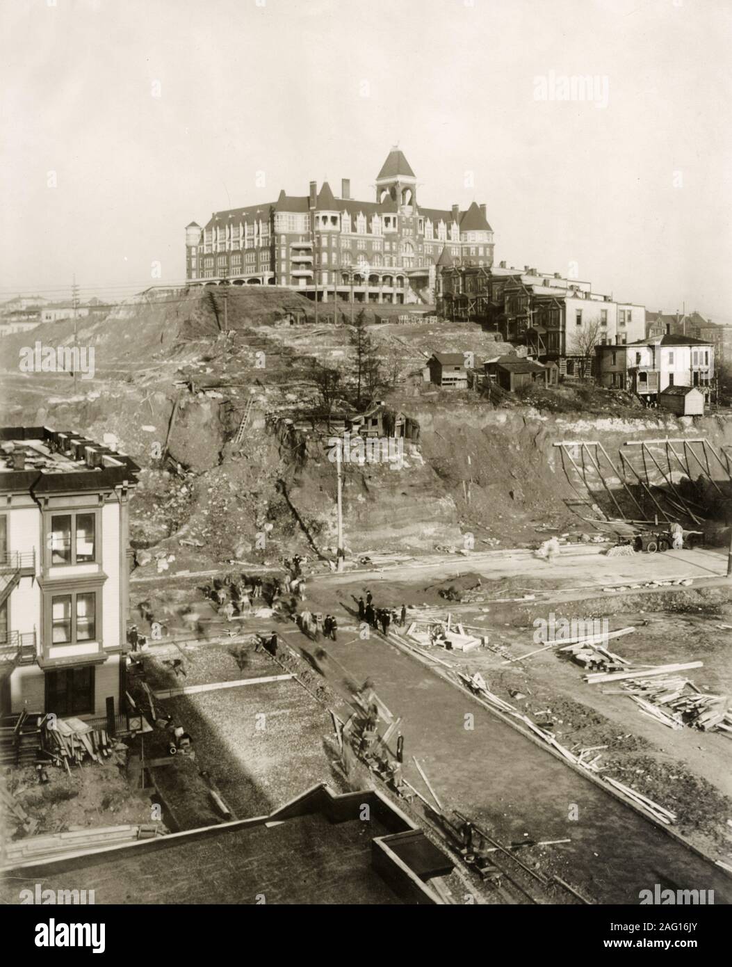 Early 20th century vintage press photograph - view of the Denny regarde underway on 2nd Avenue Seattle, with the old Denny / Washington hotel at the top of the hill. Stock Photo