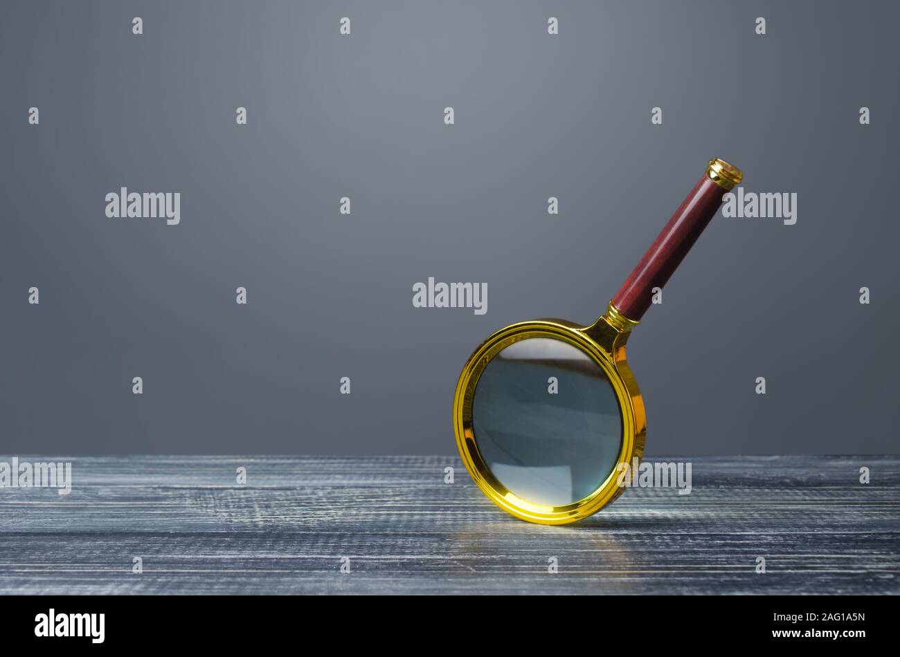 People look at a huge magnifying glass. Search and analysis, analytics and study. Pay attention to details and problems. Find something. Journalistic Stock Photo