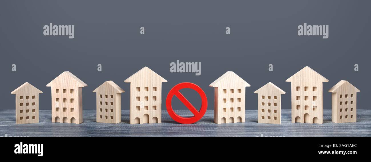 A red prohibition sign no stands among residential buildings