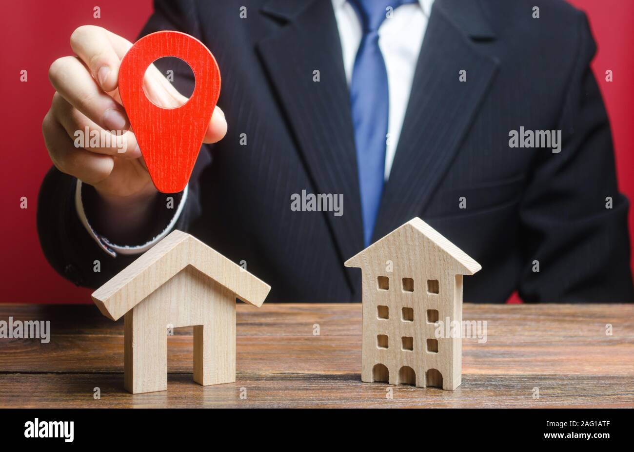 A man prefers to choose a private house rather than an apartment residential building. Type of optimal convenient housing. Definition for current need Stock Photo