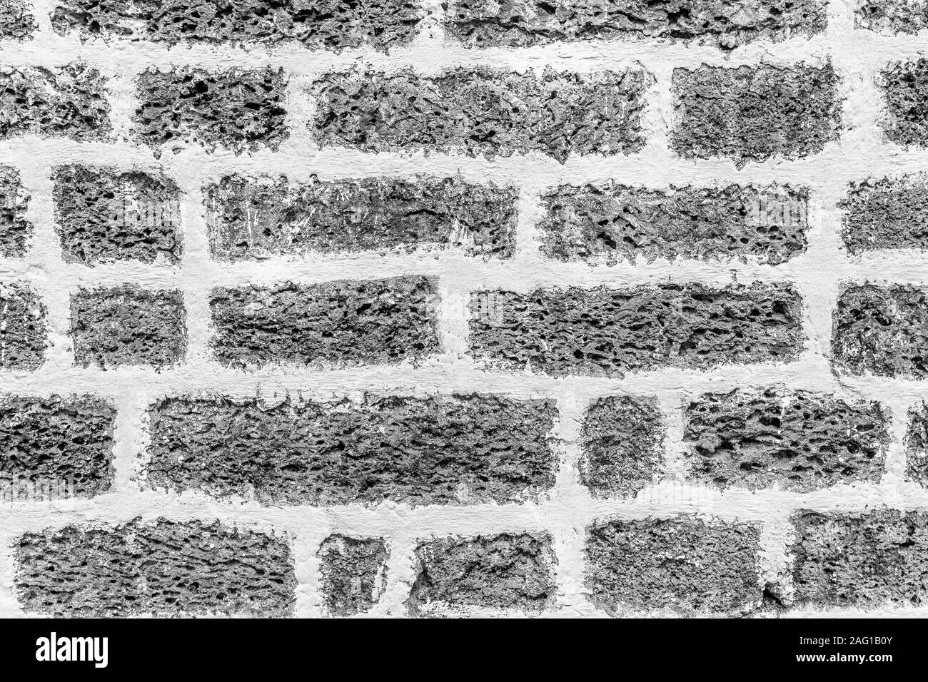 Black and white background of ancient stone wall. Texture of old brick ...