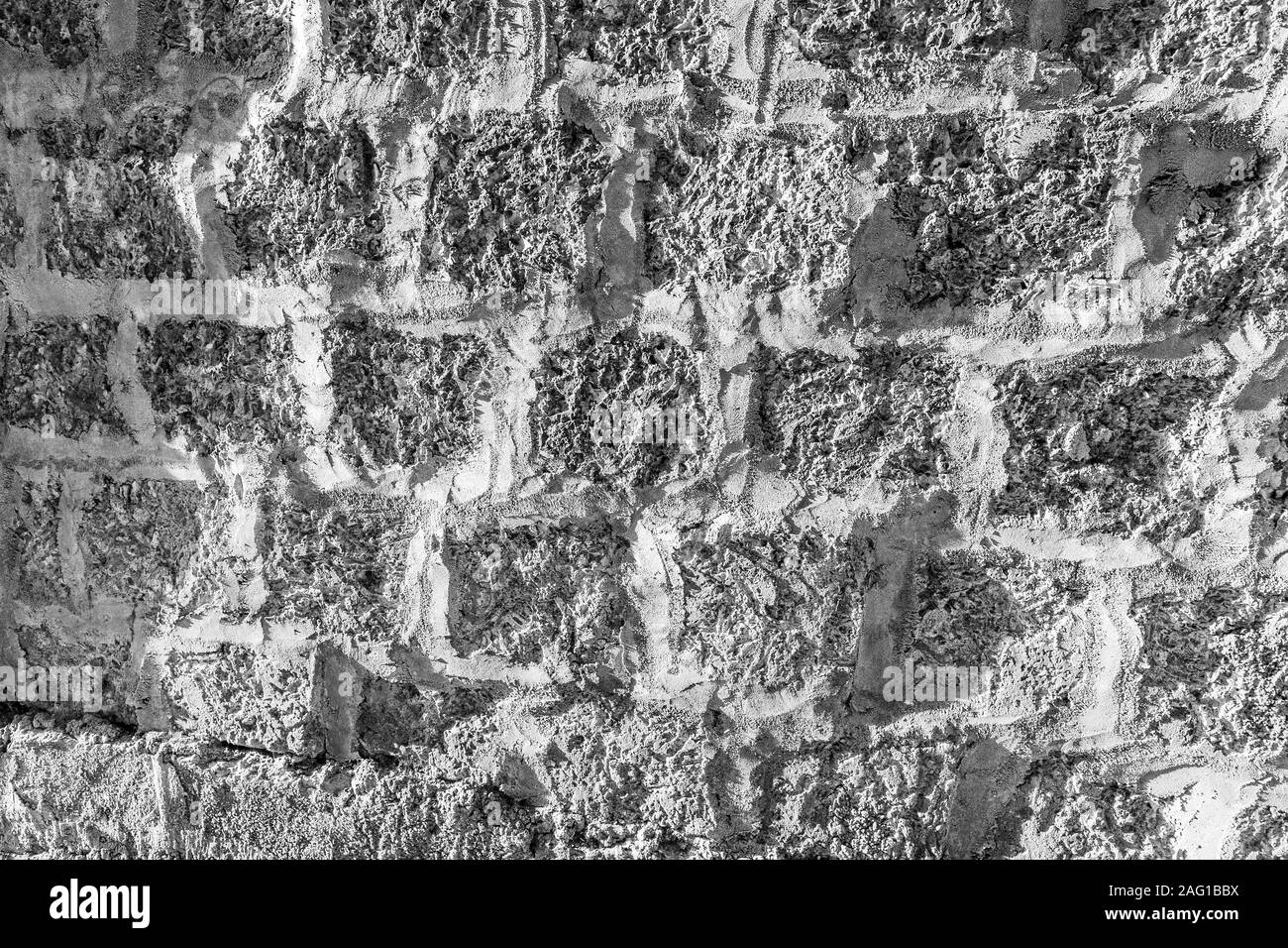 Black and white background of ancient stone wall. Texture of old brick ...