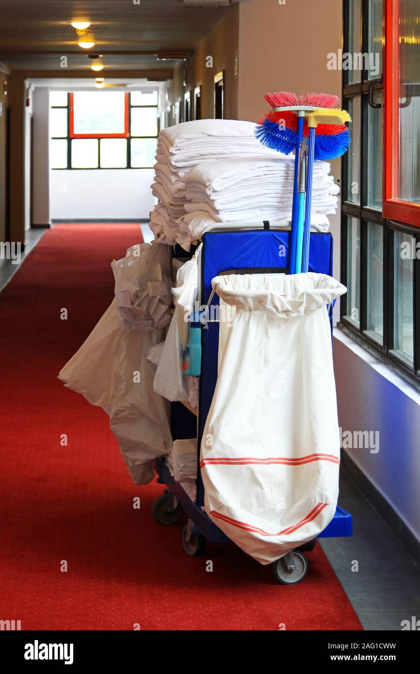 Cleaning utility janitorial cart in hotel corridor Stock Photo Alamy