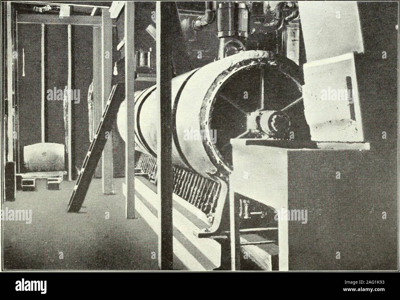 . Report of the Commissioner for the year ending June 30, 1902. RECEIVING-BIN FOR FISH AT MENHADEN FACTORY.. CONTINUOUS STEAM-COOKER. USED BY FISHERIES COMPANY AT PROMISED LAND. NEW YORK. AQUATIC PEODUCTS AS FERTILIZERS. 261 middle, where is stationed a trough or chute with a covering movablein sections of short length. In this trough runs a conveyor, consist-ing of two ijarallel endless chains, between which, at intervals of 2 or3 feet, are attached pieces of board which act as buckets to push thefish along through the trough when a section of the covering is removed.This trough with endless Stock Photo