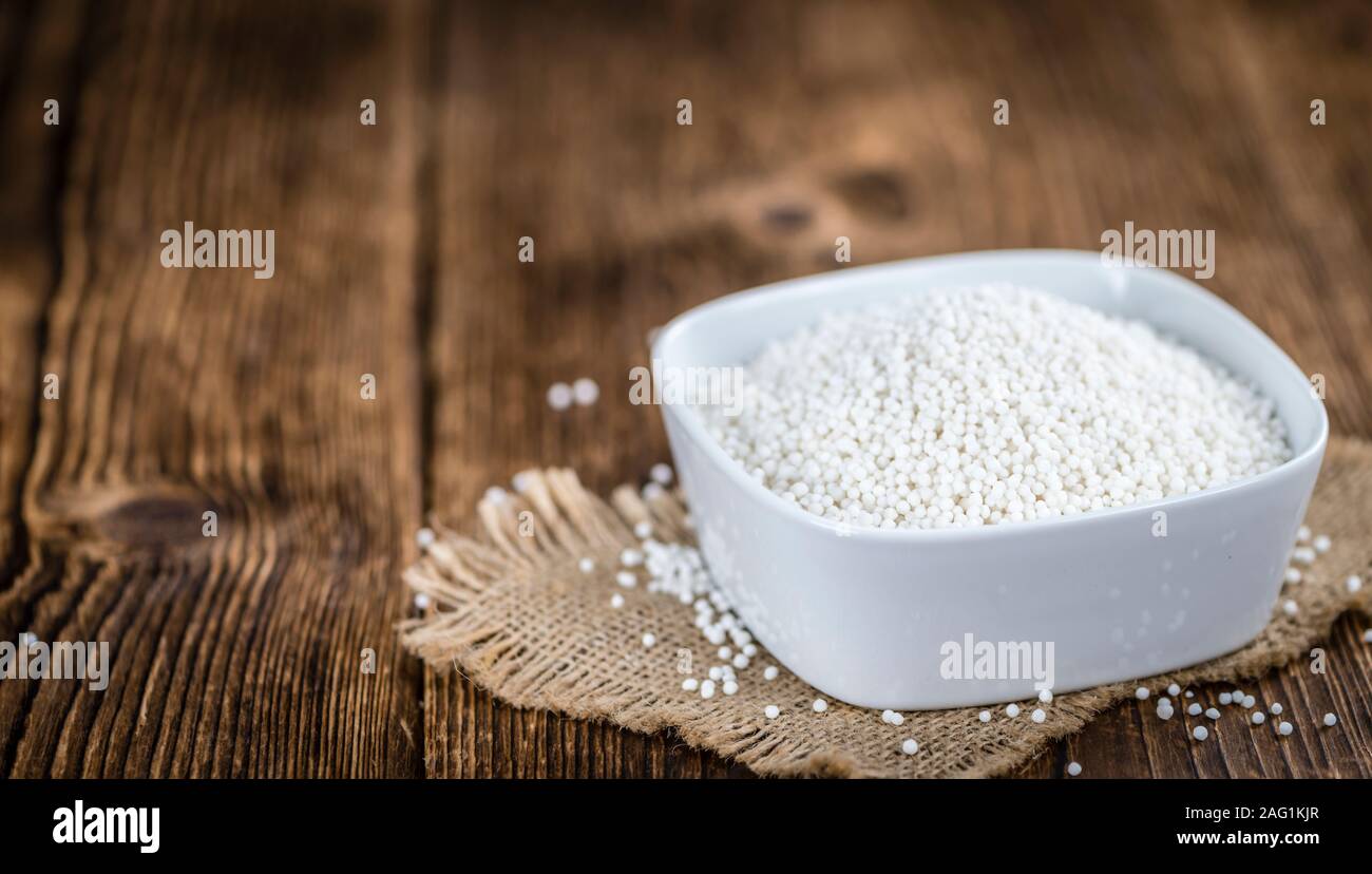 Portion of Tapioca (close-up shot; selective focus) on wooden background Stock Photo