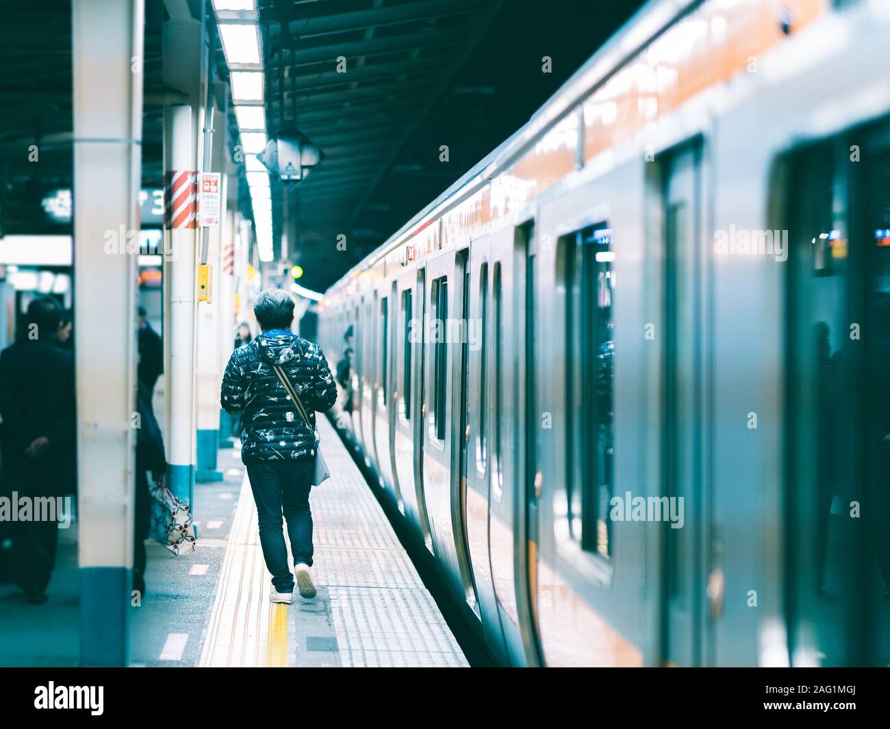 Man Waits For Doors To Open In A Metro Station Under The City Of