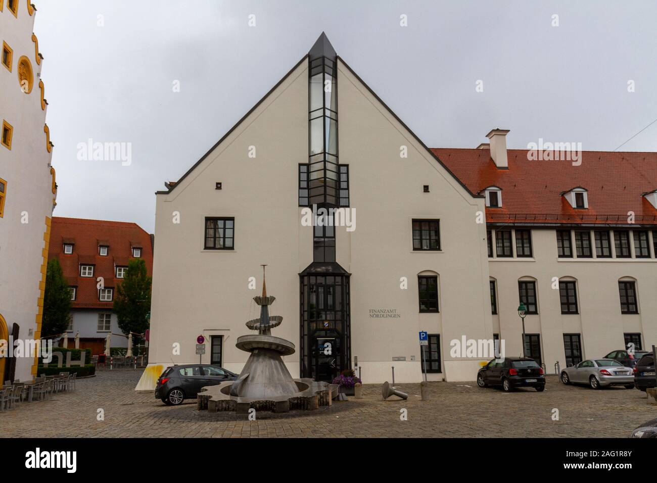 Dr. Oetker Brunnen fountain in front of the Finanzamt Nördlingen building, Bavaria, Germany. Stock Photo