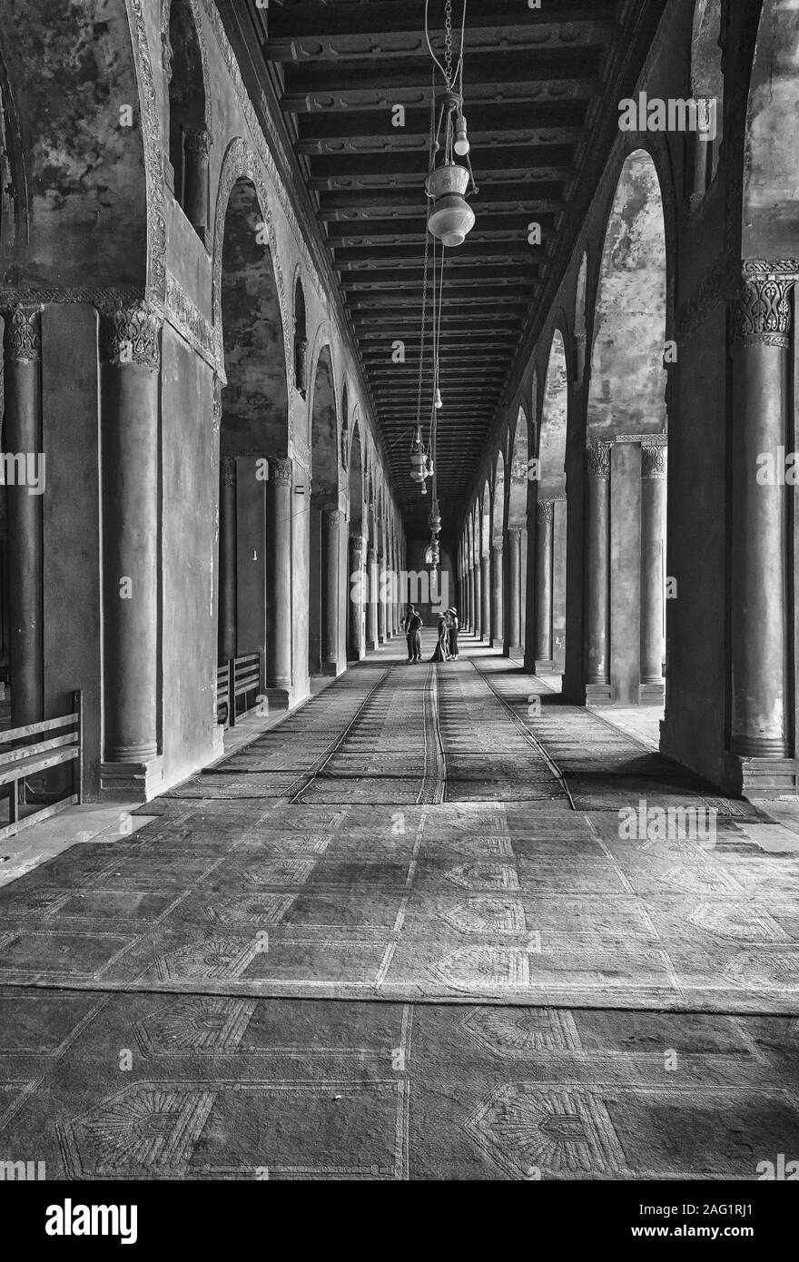 Looking down one of the 5 arcades of the eastern portico in Ibn Tulun Mosque Stock Photo
