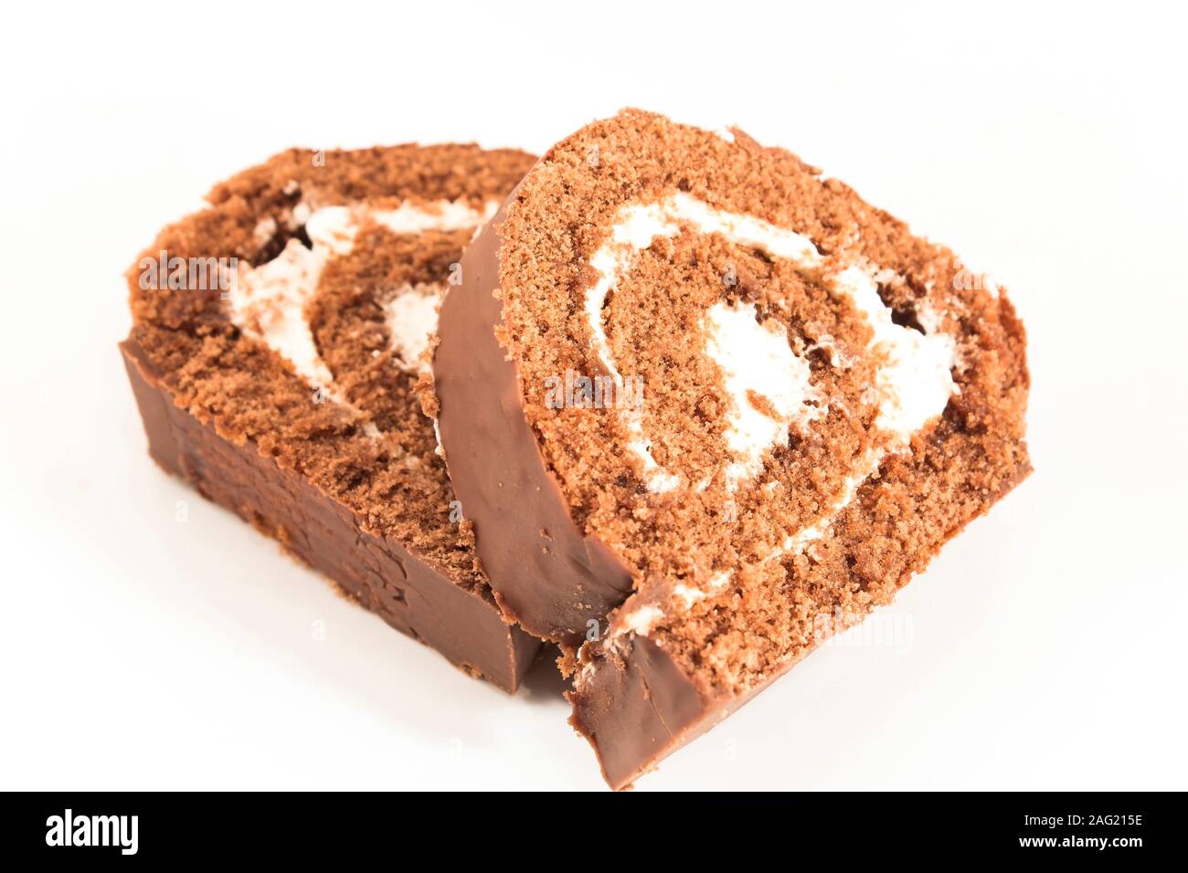 Sponge Cake Chocolate Roll Isolated on White. Stock Photo