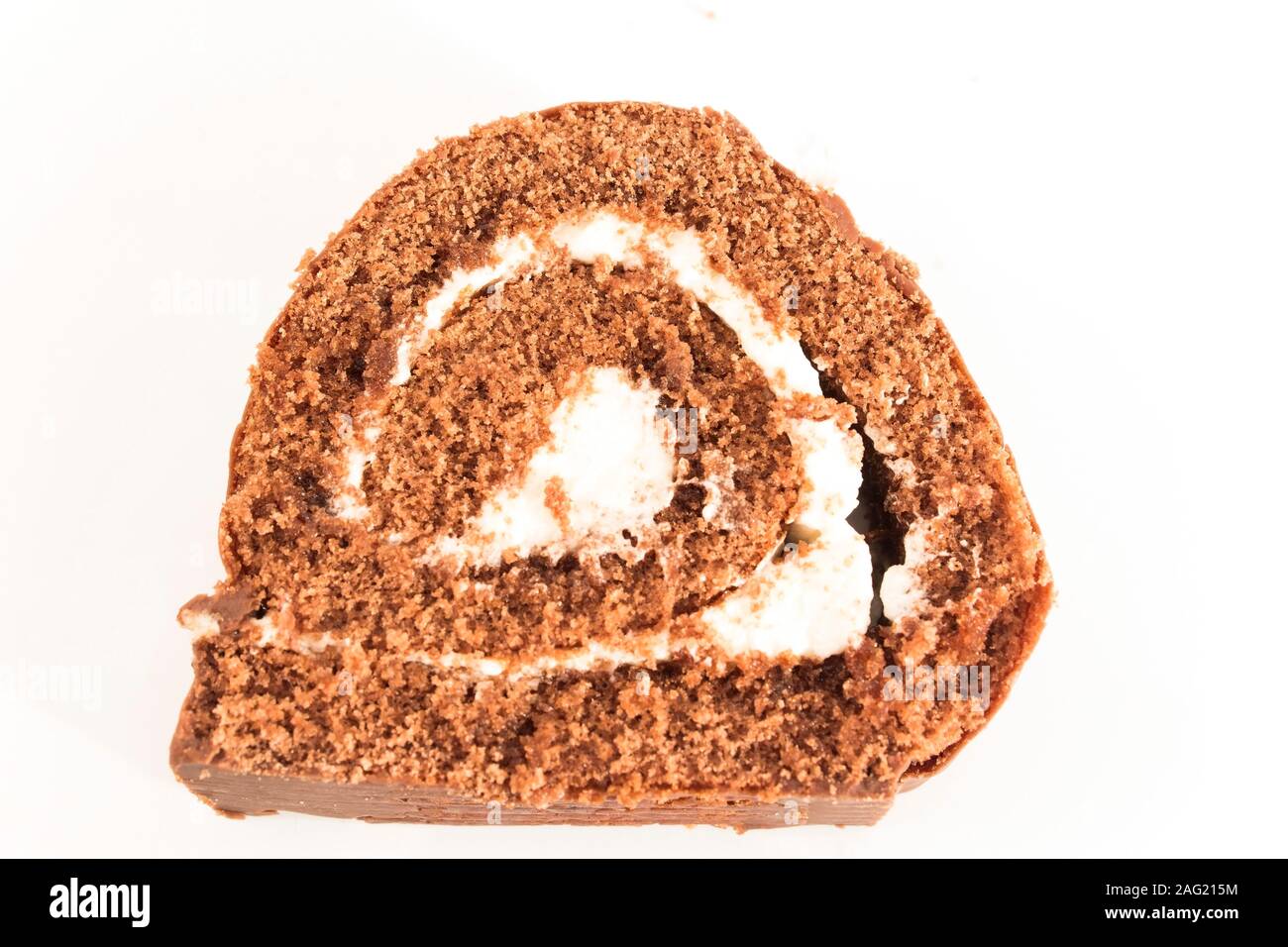 Sponge Cake Chocolate Roll Isolated on White. Stock Photo