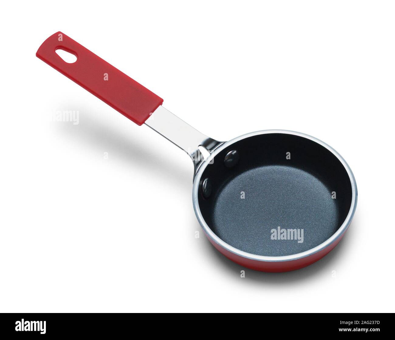 Small Red Frying Pan Isolated on White Background. Stock Photo