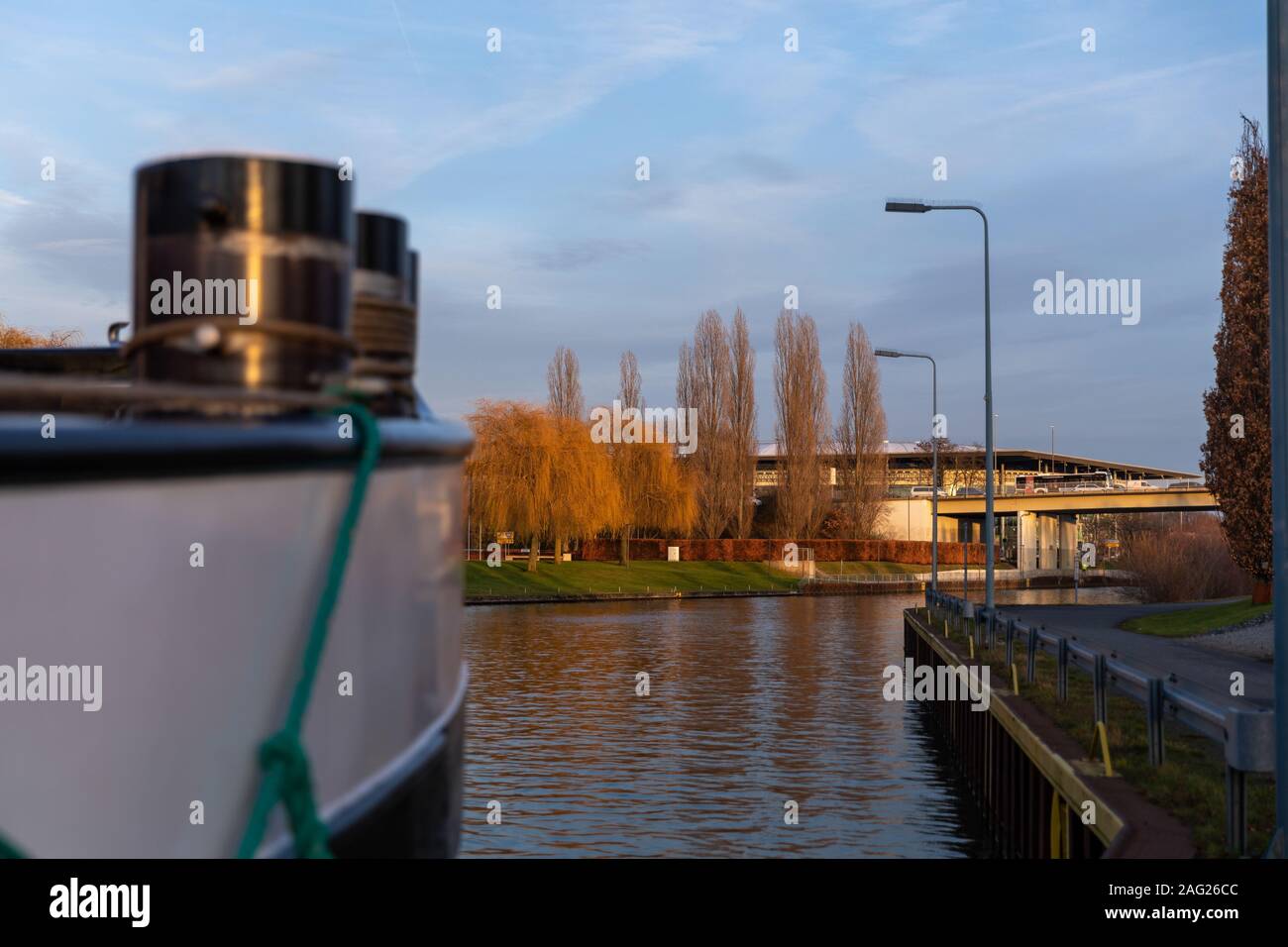 Mittelland canal is an active transport route in Germany. Ship anchored in Wolfsburg for dropping off cargo and rest for crew. Stock Photo