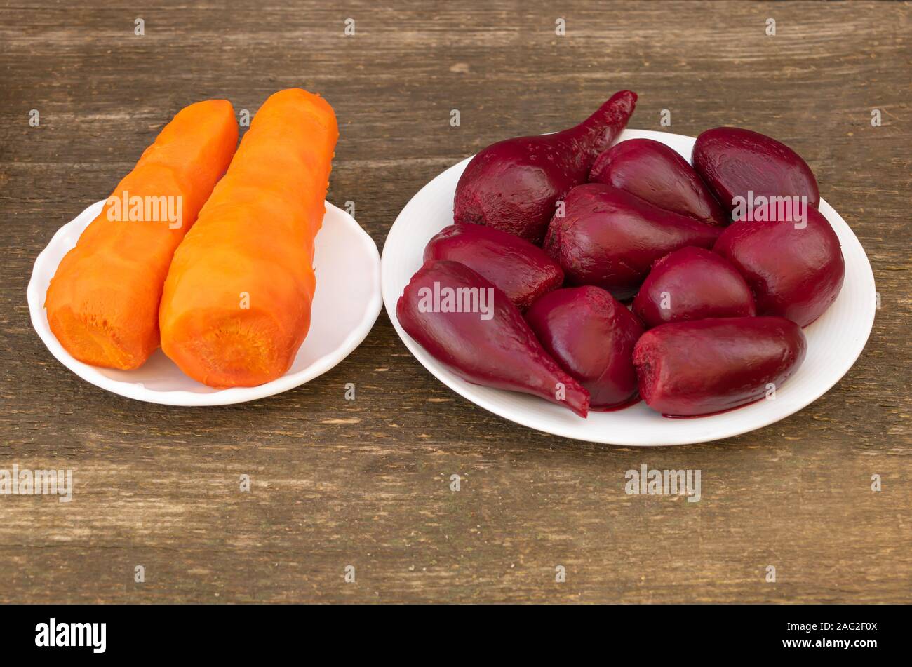 Red beet and carrot boiled in the cooking process. Vegetables health  benefits concept Stock Photo - Alamy