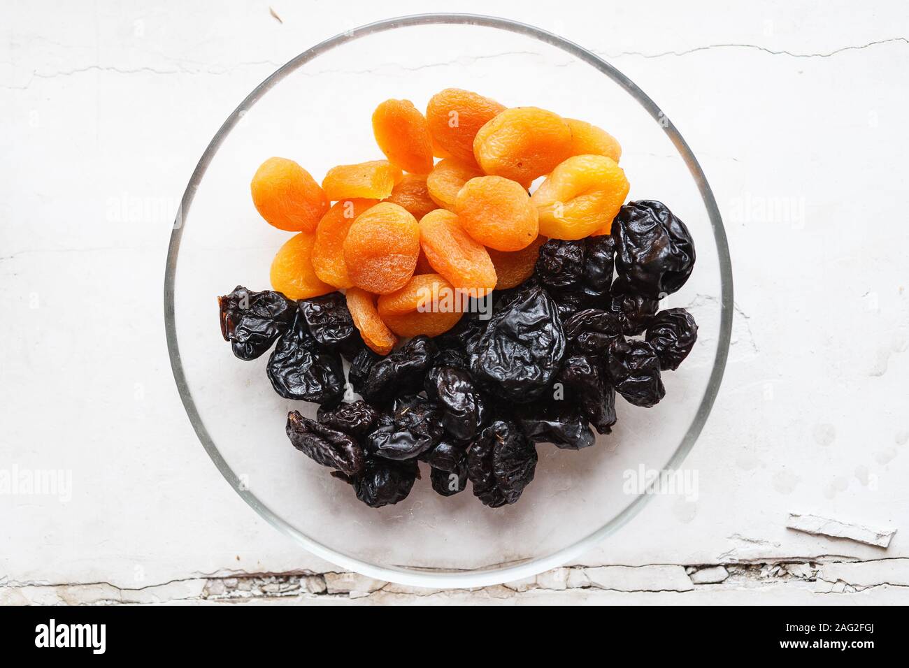 Dried apricots and prunes in a cup Stock Photo Alamy