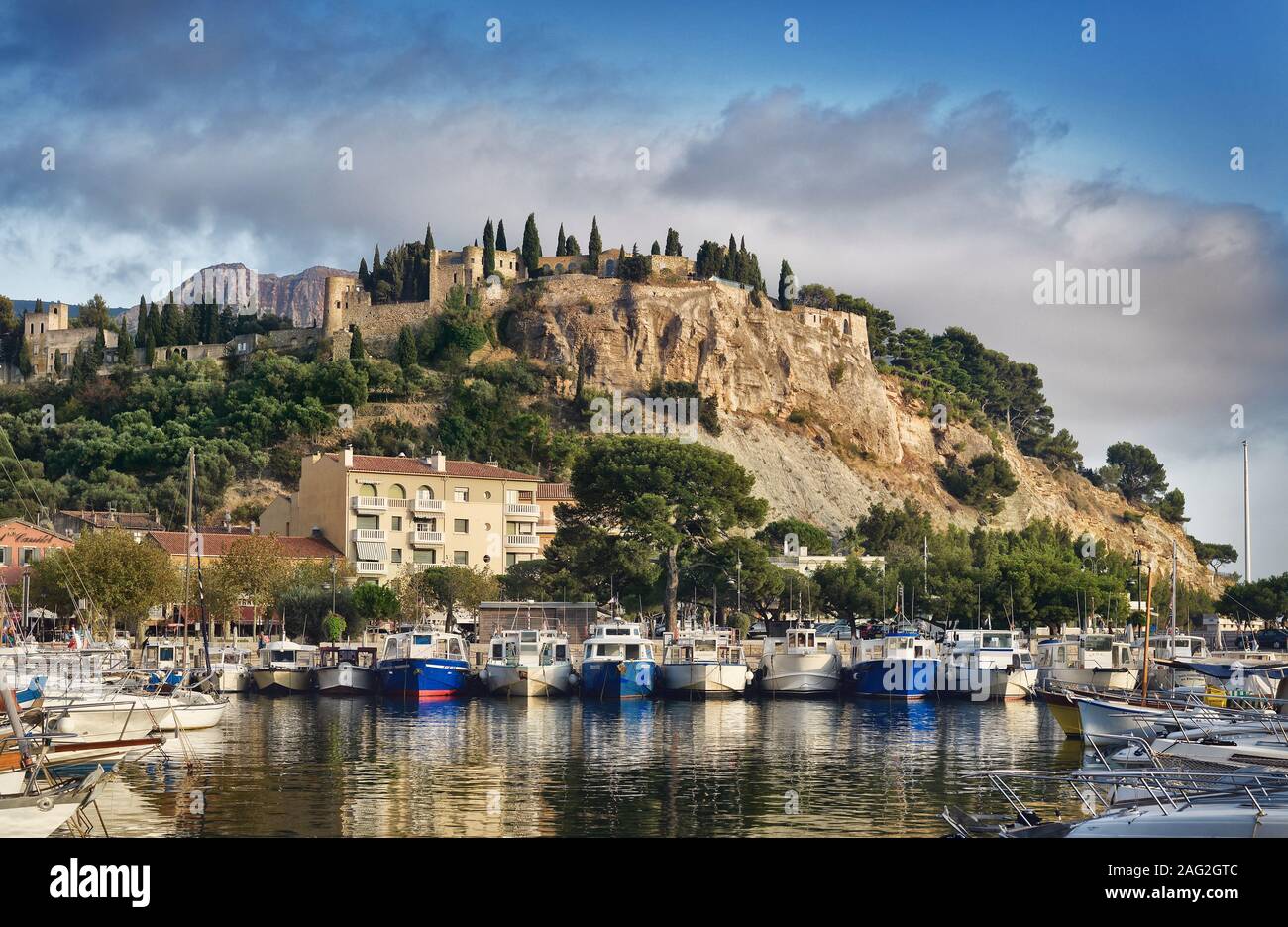 Chateau de Cassis, 13th Century French castle on top of a cliff in Cassis port town, view from the harbor. Southern France. Château de Cassis. Cassis Stock Photo