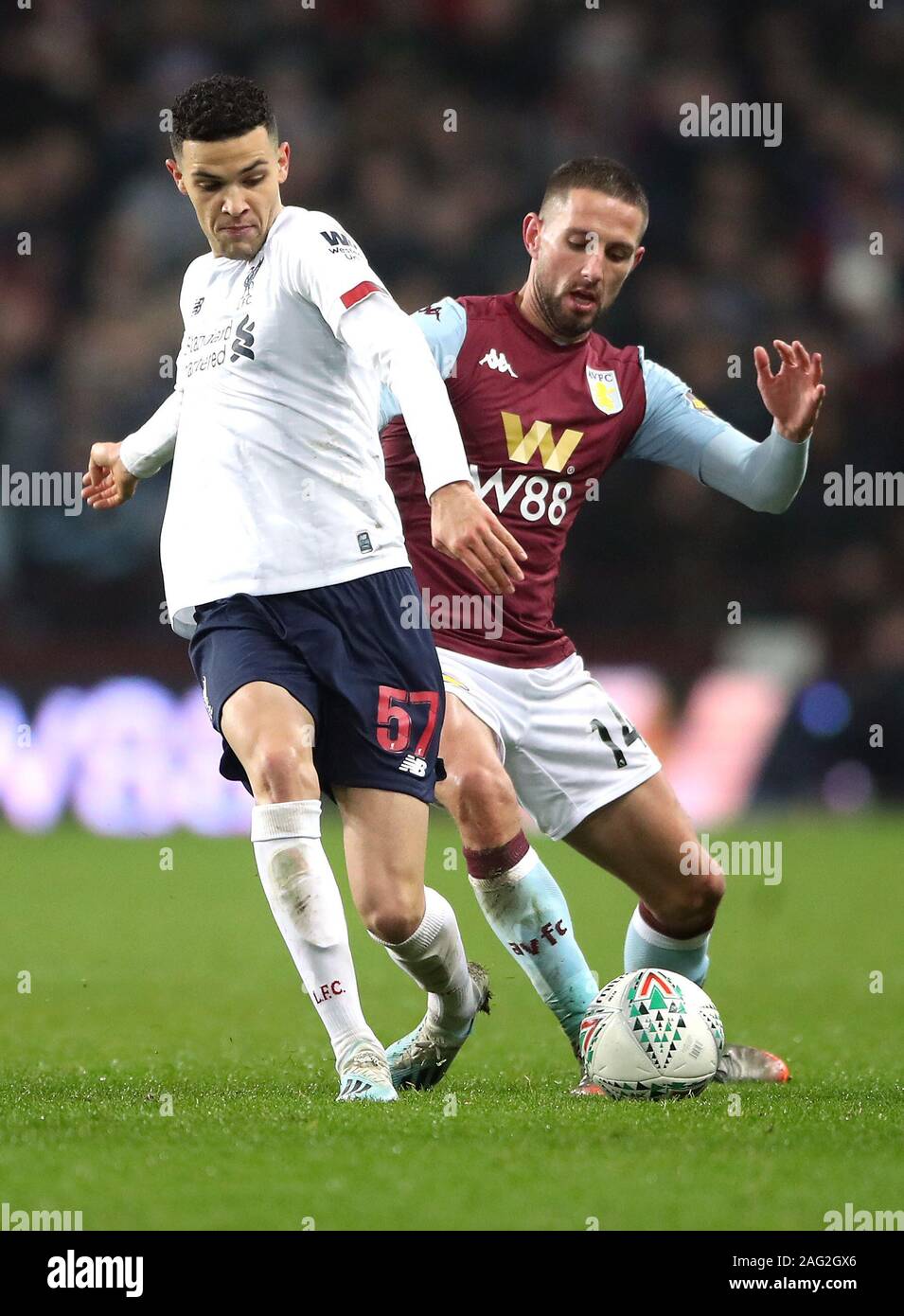 Liverpool's Isaac Christie-Davies (left) and Aston Villa's Conor Hourihane battle for the ball during the Carabao Cup, Quarter Final match at Villa Park, Birmingham. Stock Photo